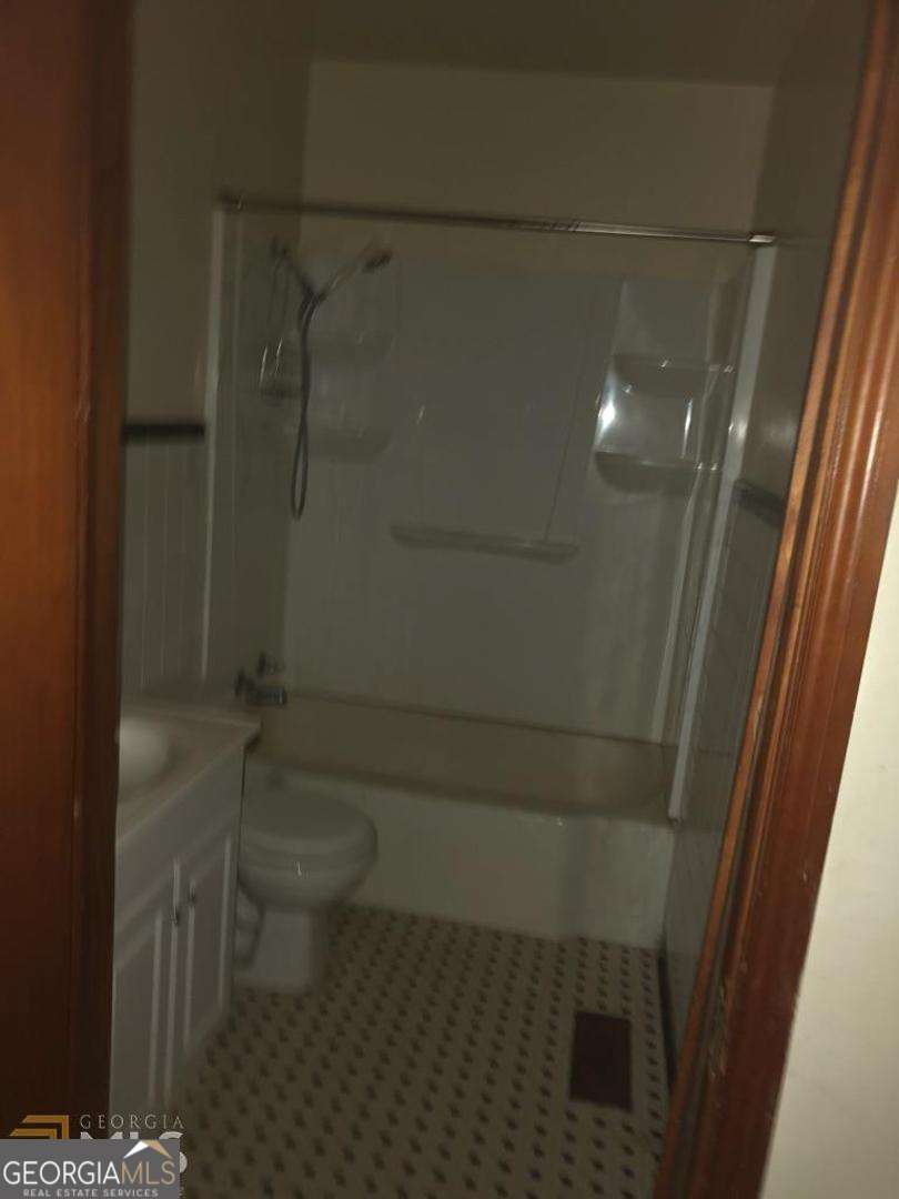 329 McDonough Road Jackson, GA 30233 - Photo 8 of 11 a bathroom with a toilet and a shower