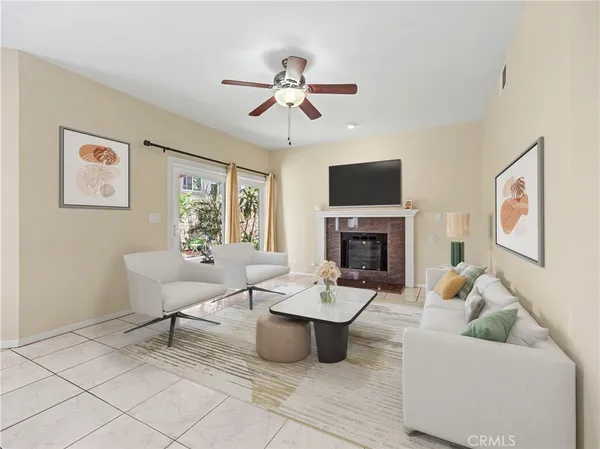 a living room with furniture and a fireplace