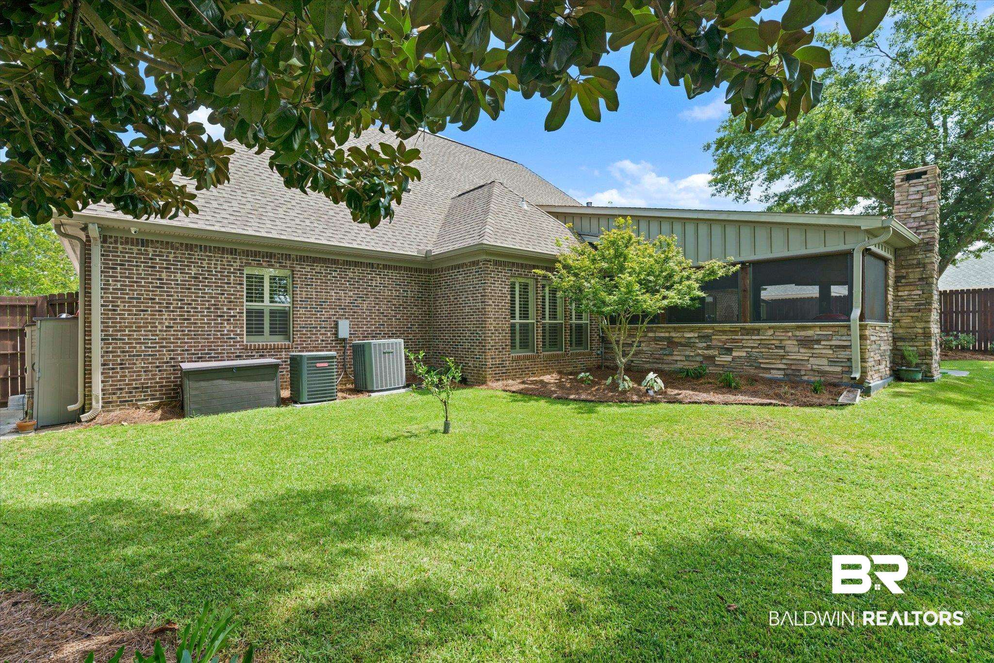 5683 Spring Landing Drive Theodore, AL 36582 - Photo 42 of 49 Back of property with a yard and cooling unit