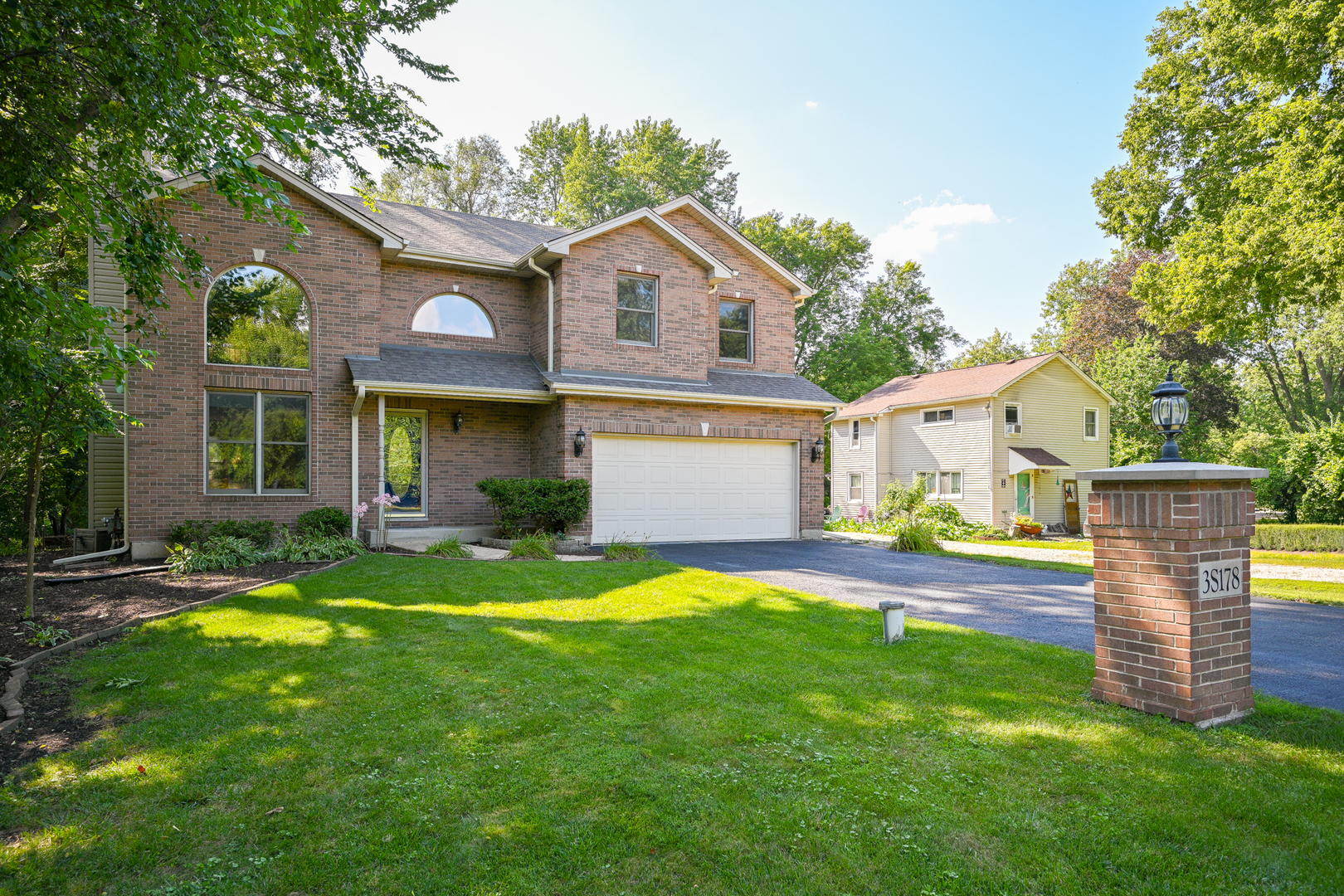 3S178 Pattermann Road Warrenville, IL 60555 - Photo 2 of 33 a view of a house with a yard and a large tree