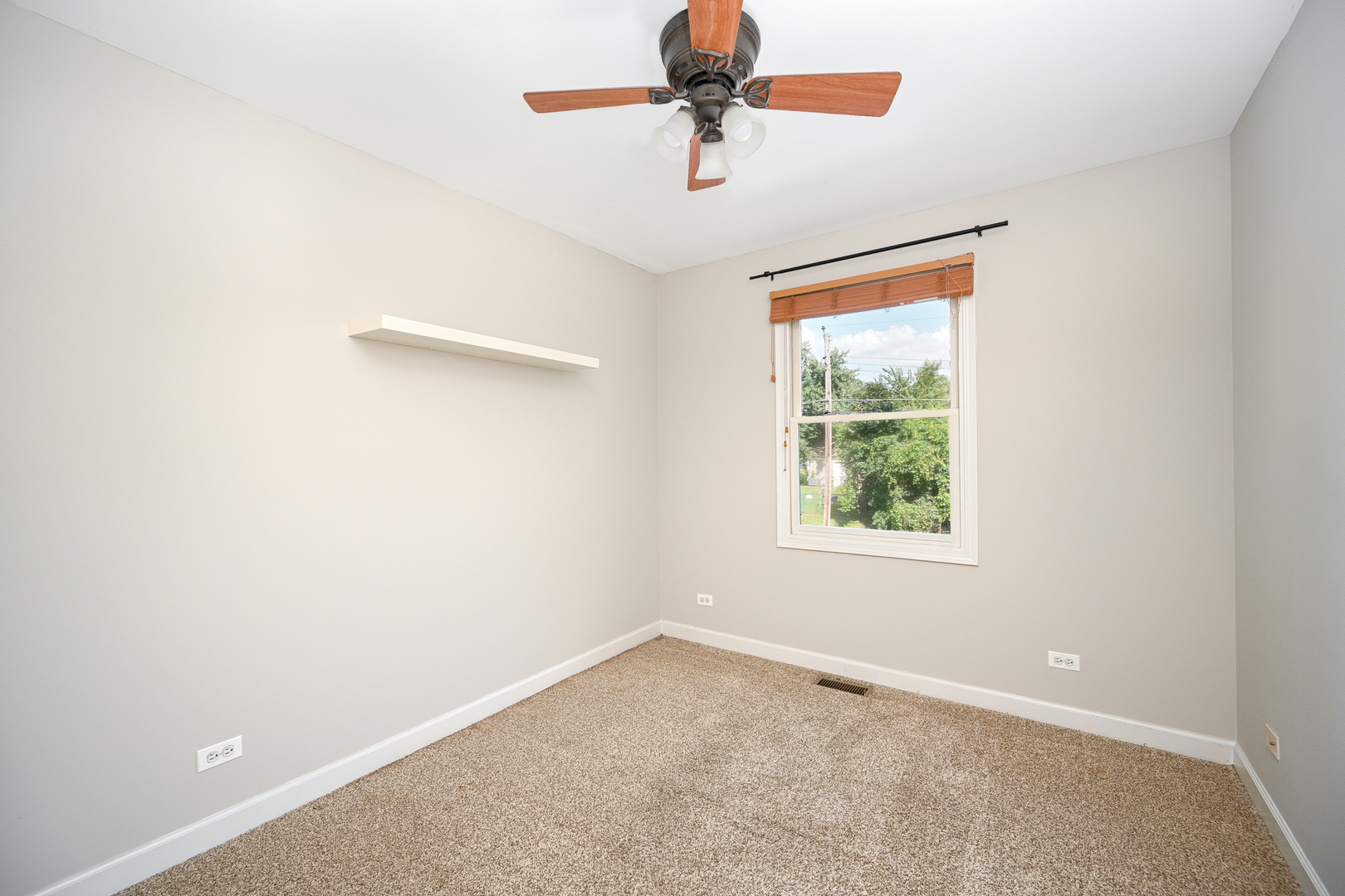 3S178 Pattermann Road Warrenville, IL 60555 - Photo 25 of 33 an empty room with a window and a fan