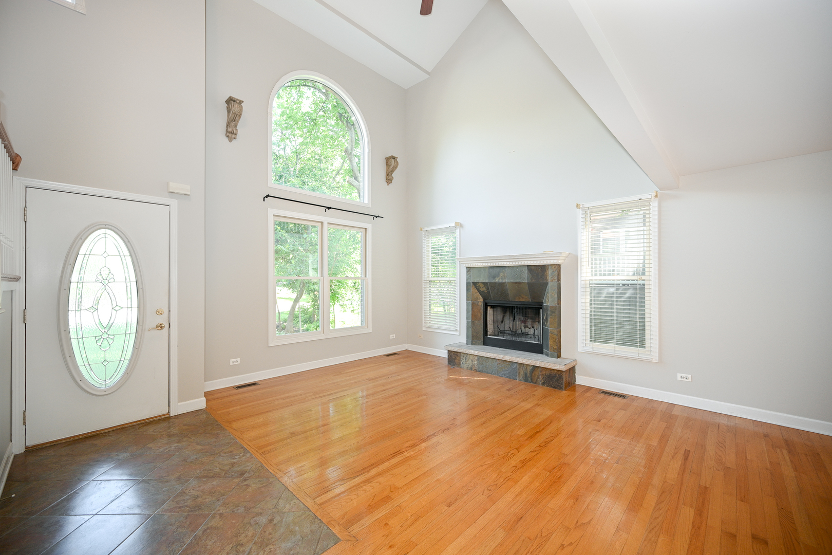 3S178 Pattermann Road Warrenville, IL 60555 - Photo 3 of 33 an empty room with window mirror and windows
