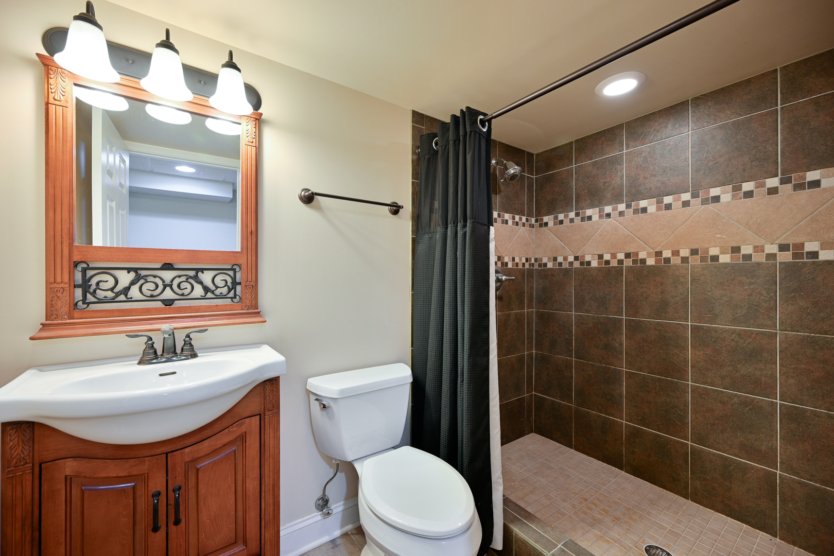 3S178 Pattermann Road Warrenville, IL 60555 - Photo 31 of 33 a bathroom with a sink toilet and shower