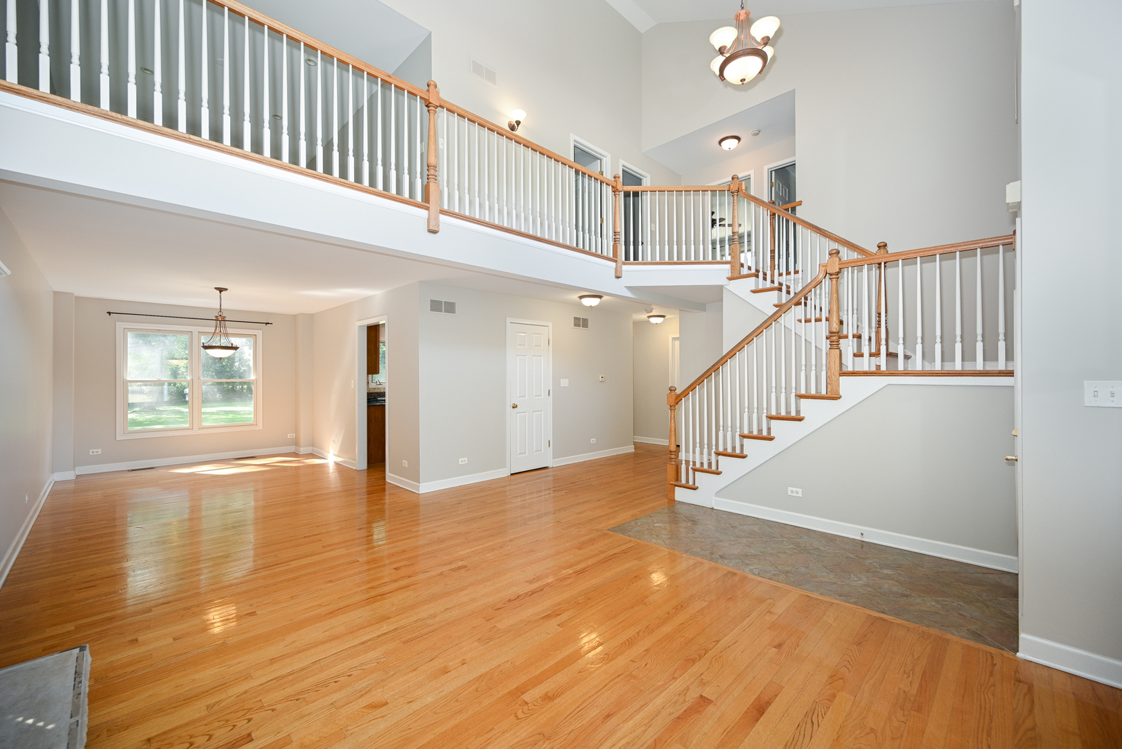 3S178 Pattermann Road Warrenville, IL 60555 - Photo 9 of 33 a view of entryway and hall with wooden floor