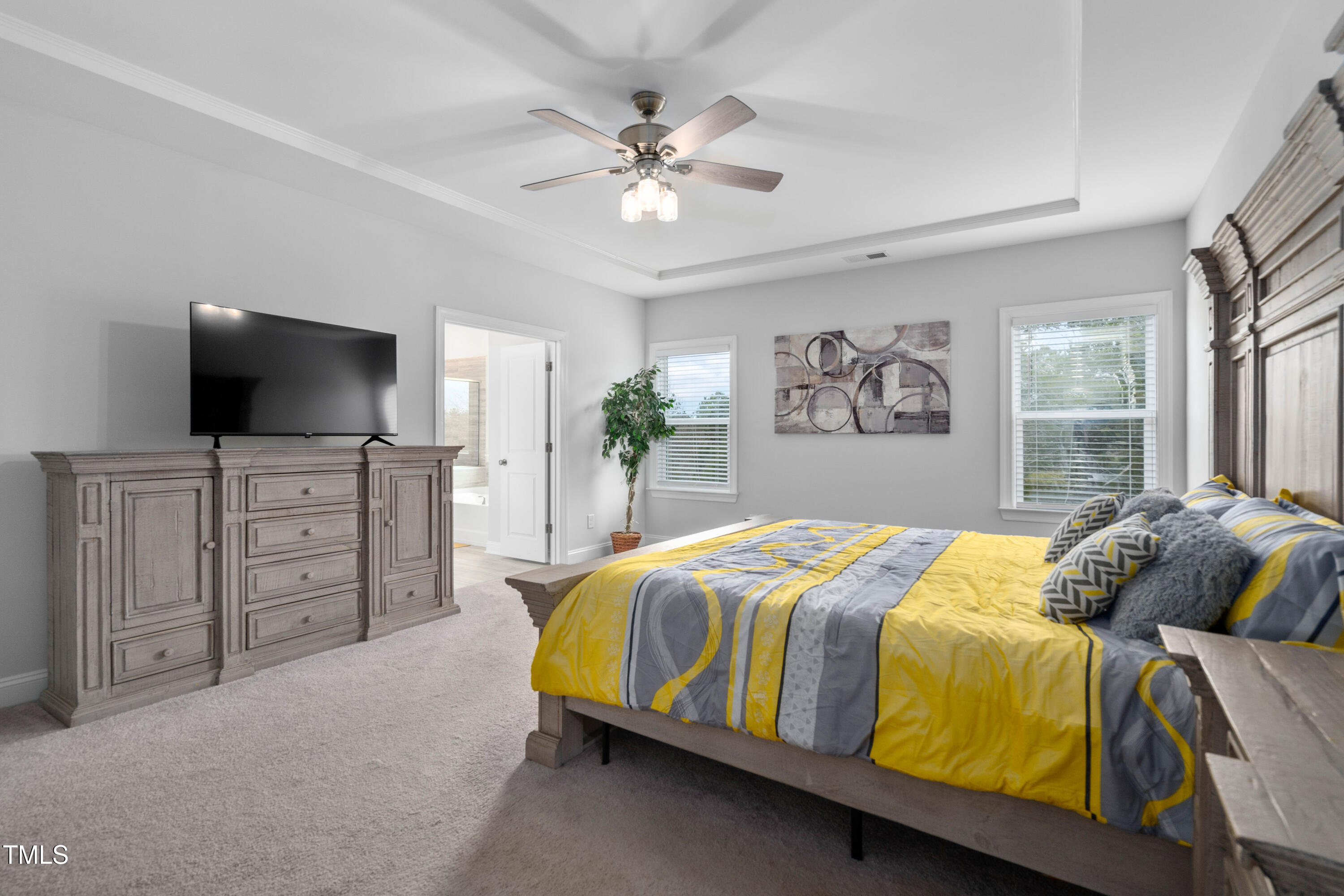 2612 Nordmann Fir Road Raleigh, NC 27616 - Photo 23 of 39 Peaceful primary with tray ceiling and wooded view to the backyard.