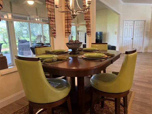 a view of a dining room with furniture and window
