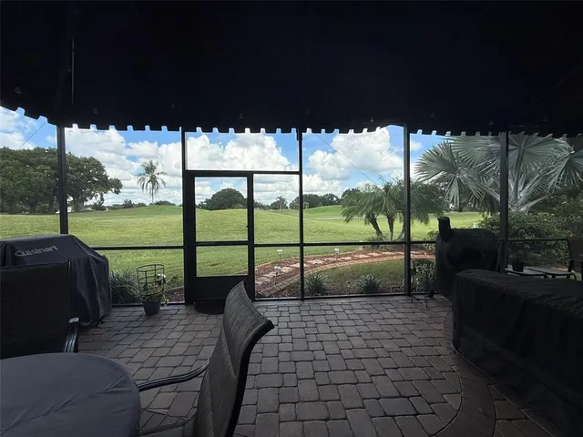 a view of a yard with a sitting space