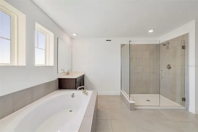 a bathroom with a bathtub and a shower
