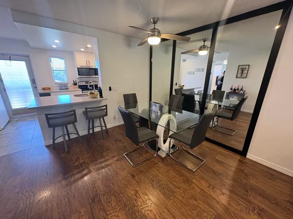 a view of a livingroom with furniture and a work space