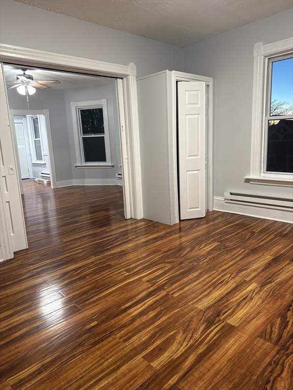 2 Orne Street, Unit 2 Worcester, MA 01605 - Photo 8 of 10 a view of a livingroom with wooden floor and stairs
