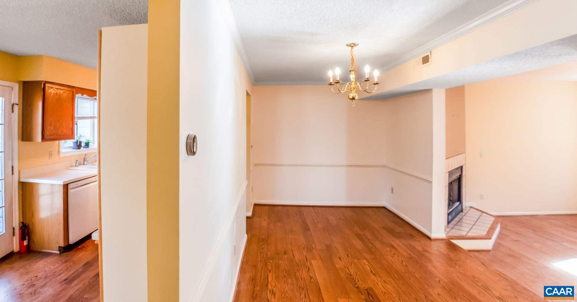 300 Westfield Road Charlottesville, VA 22901 - Photo 10 of 26 a view of a room with wooden floor and staircase