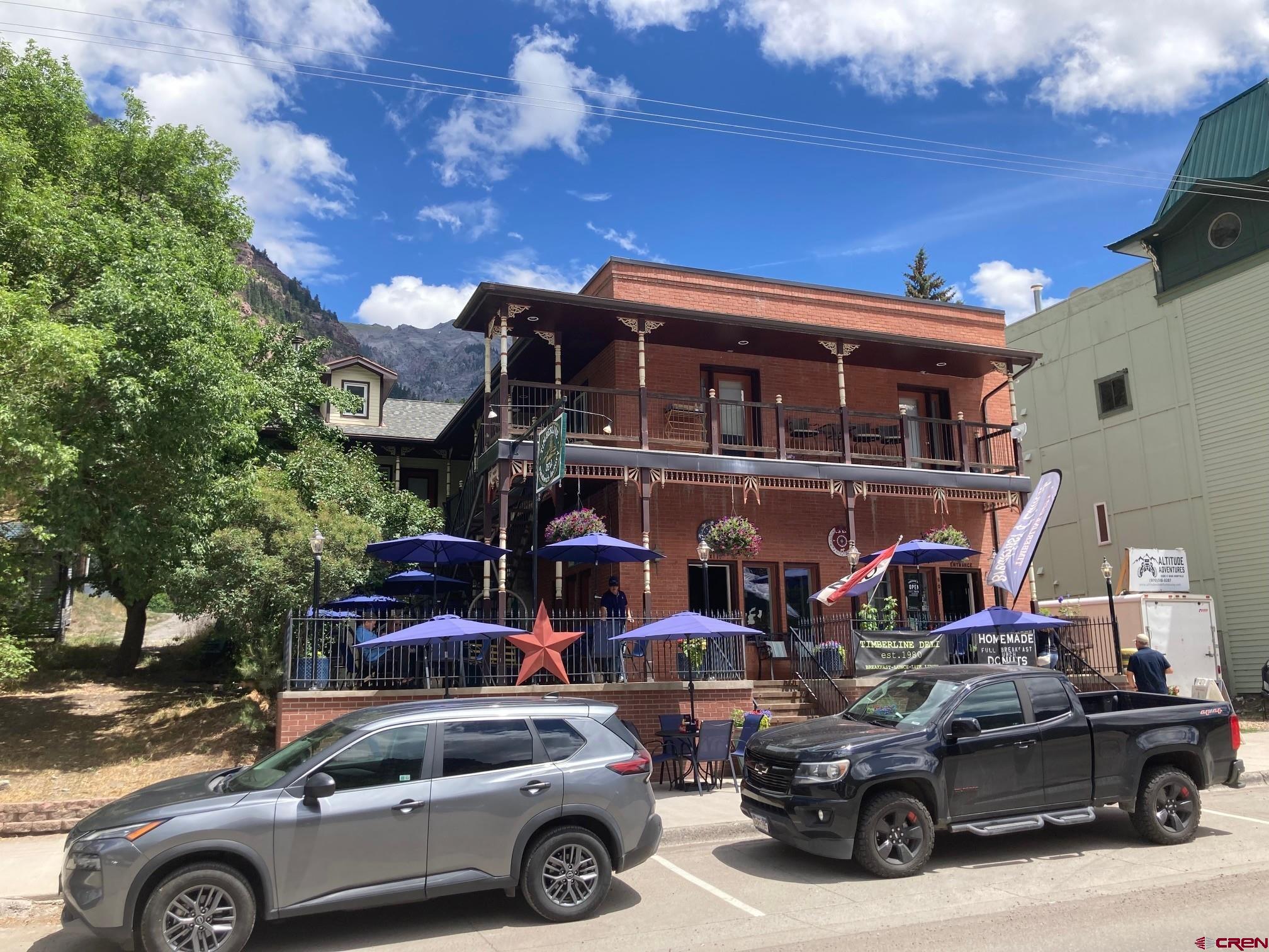 807 Main Street, Unit 3 Ouray, CO 81427 - Photo 1 of 22 a front view of a house with parking space