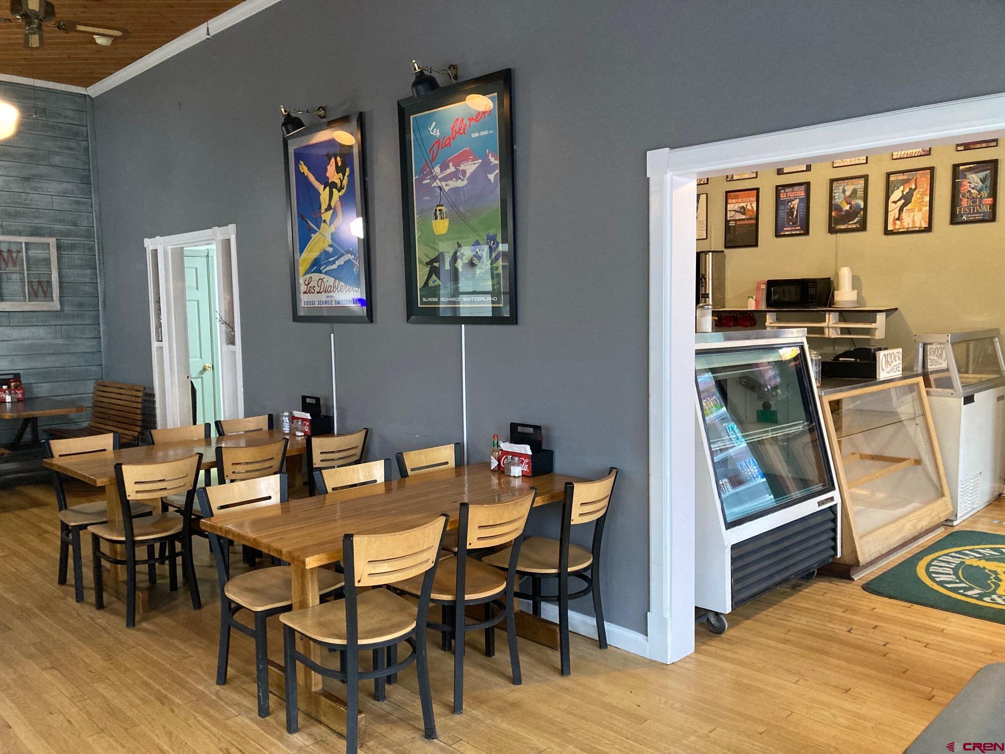 807 Main Street, Unit 3 Ouray, CO 81427 - Photo 14 of 22 a view of a dining room with furniture kitchen and wooden floor