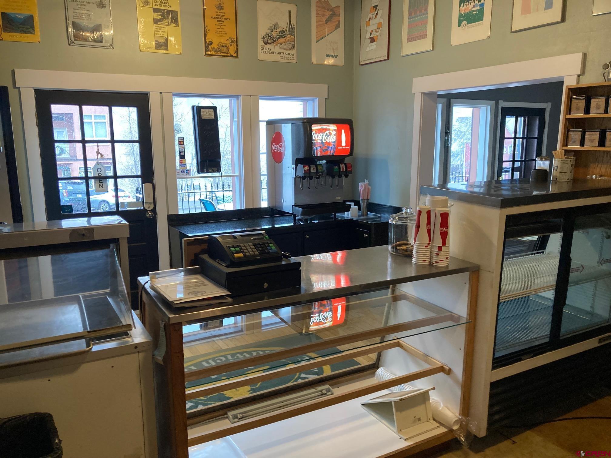 807 Main Street, Unit 3 Ouray, CO 81427 - Photo 16 of 22 a living room with furniture a flat screen tv and a fireplace