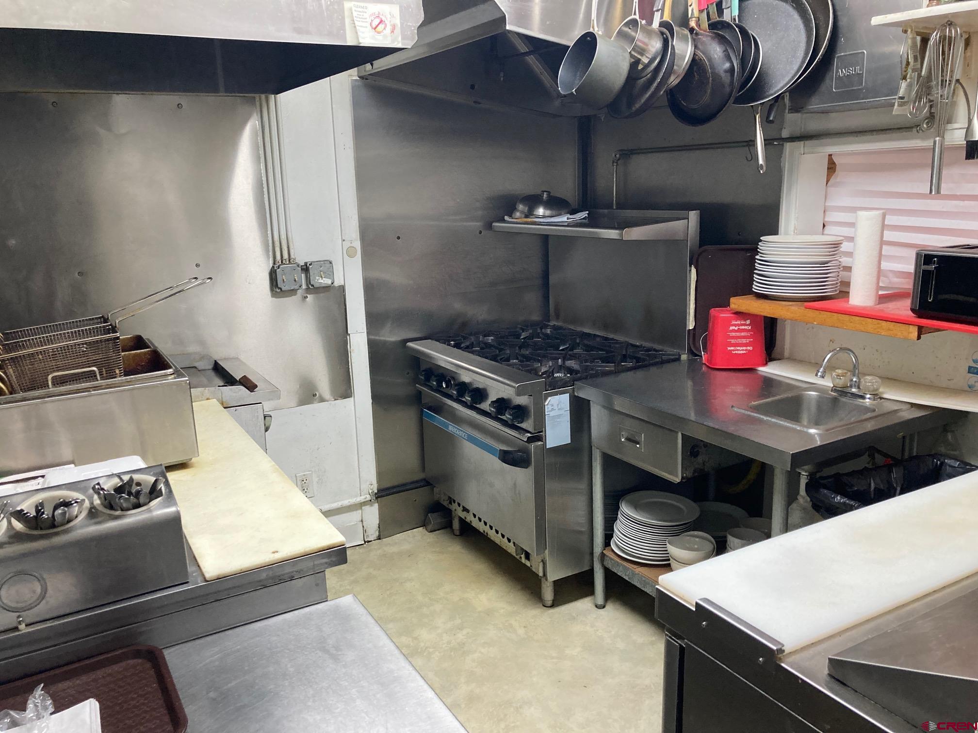 807 Main Street, Unit 3 Ouray, CO 81427 - Photo 18 of 22 a kitchen with a stove and a sink
