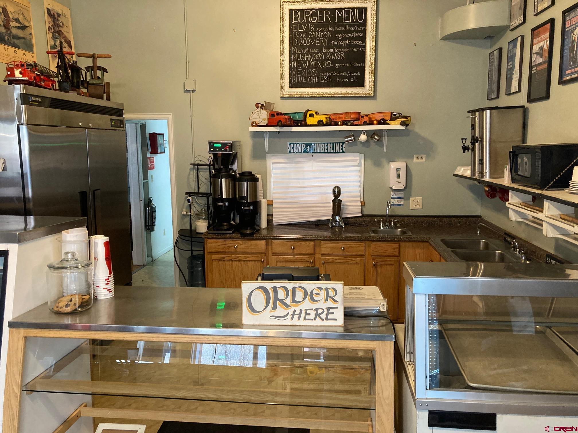 807 Main Street, Unit 3 Ouray, CO 81427 - Photo 20 of 22 a kitchen with kitchen island granite countertop a stove and a sink
