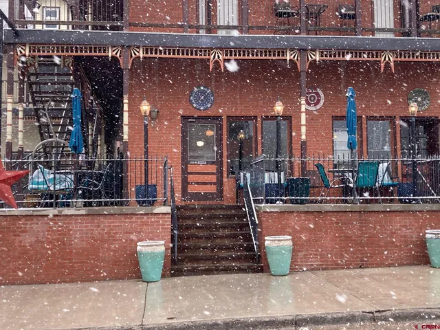 a view of a street with sitting area