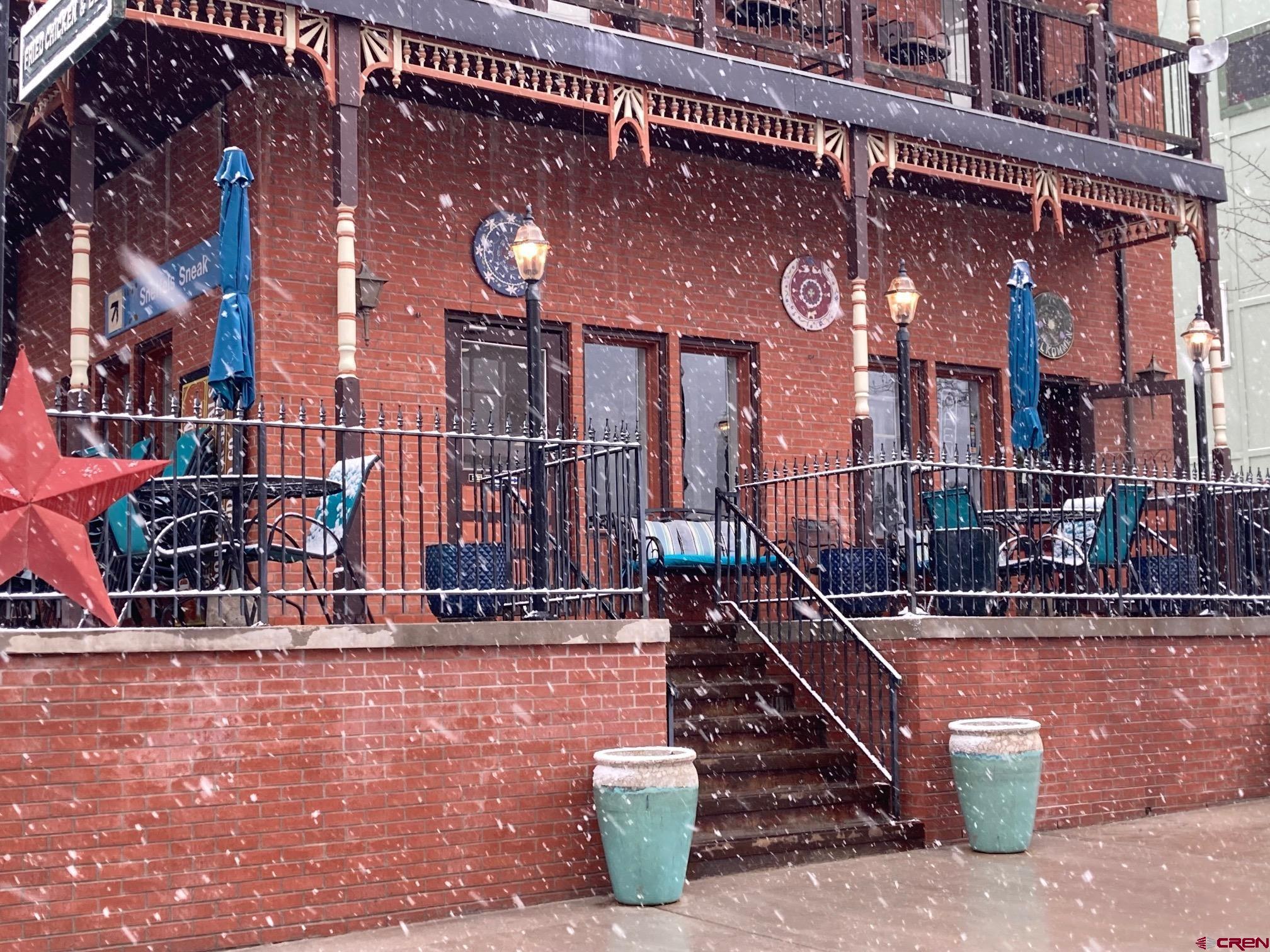 807 Main Street, Unit 3 Ouray, CO 81427 - Photo 3 of 22 a front view of a building with street