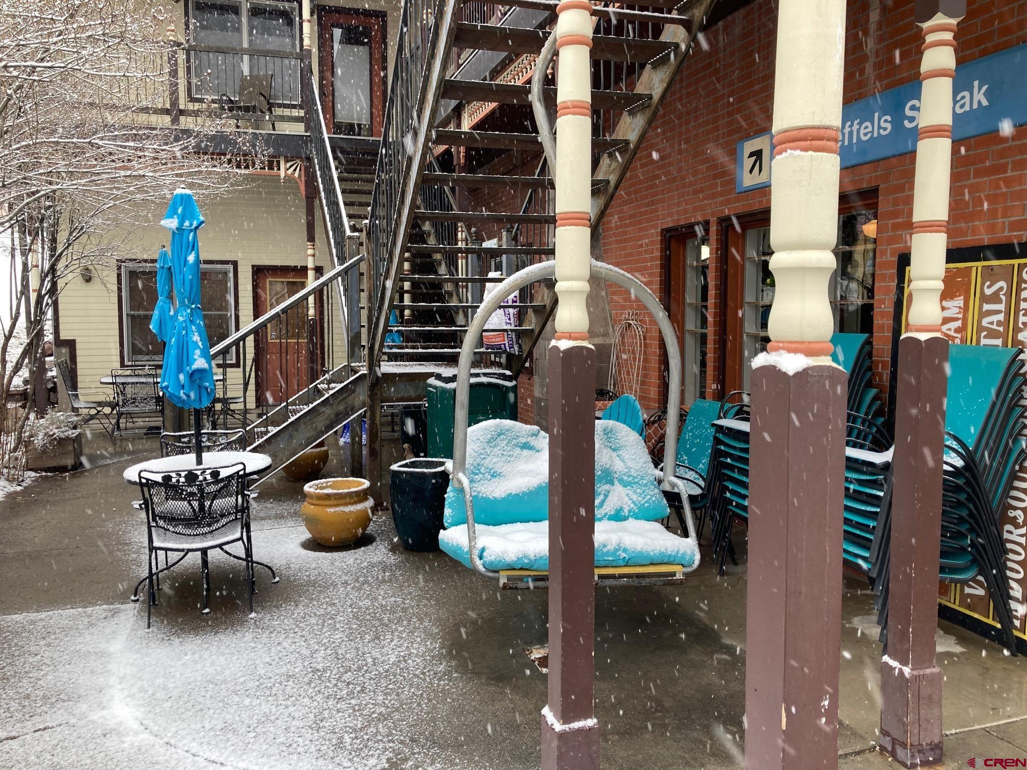 807 Main Street, Unit 3 Ouray, CO 81427 - Photo 8 of 22 a view of steet chairs and table in the patio