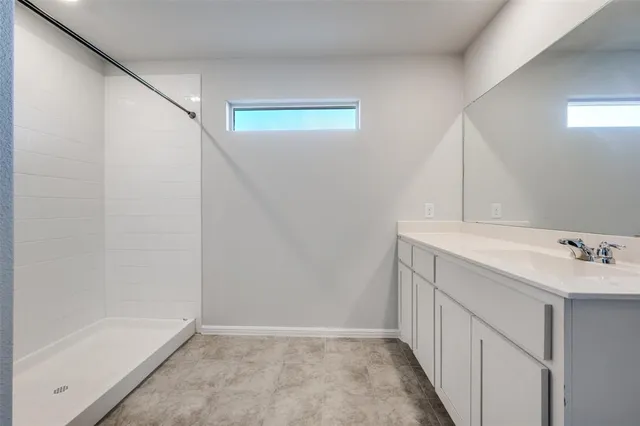 a bathroom with a sink and mirror