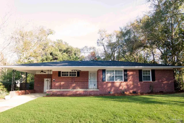 front view of a house with a yard