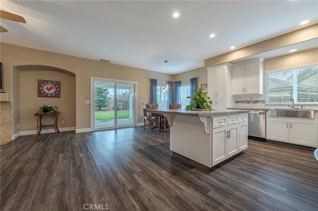 a large kitchen with a table and chairs