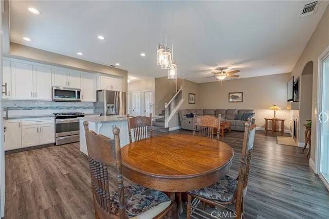 an empty room with closet and windows
