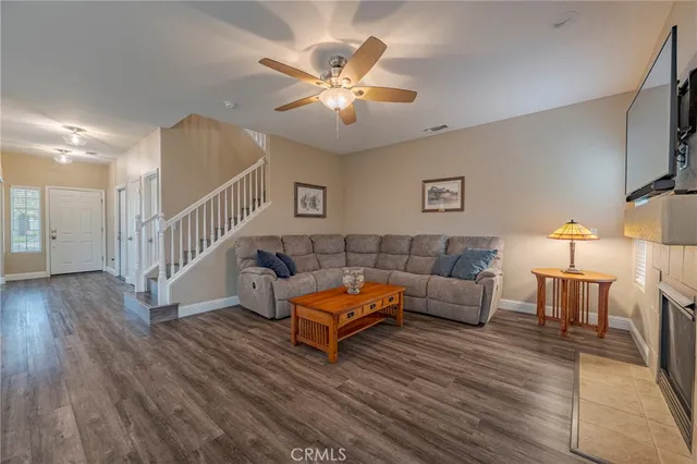 a spacious bathroom with a granite countertop sink a mirror and a shower
