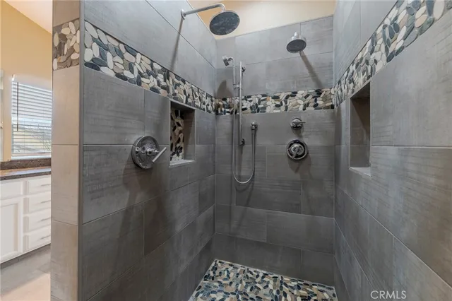 a view of a house with a yard and potted plants