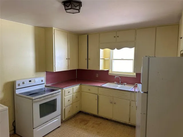 a kitchen with a stove and a microwave