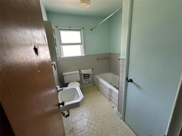 a view of a room with wooden walls