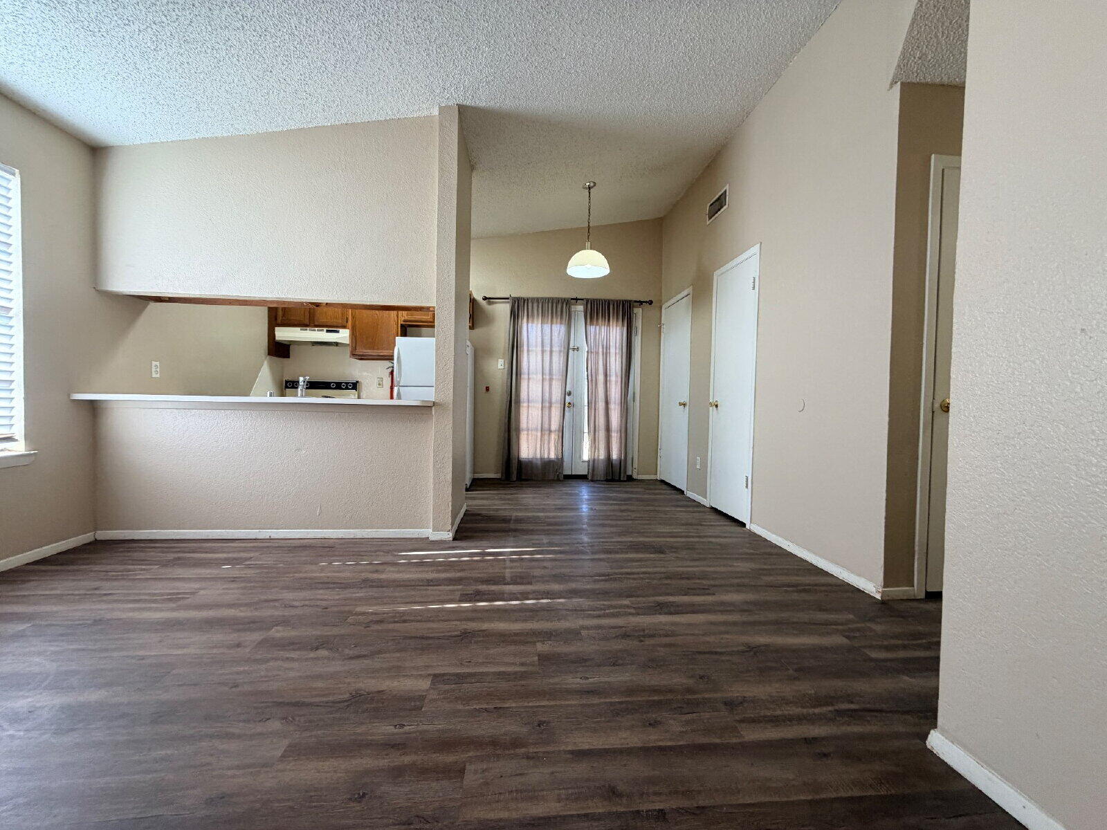 129 North Troy Avenue, Unit B Lubbock, TX 79416 - Photo 2 of 9 a view of a kitchen cabinets and wooden floor