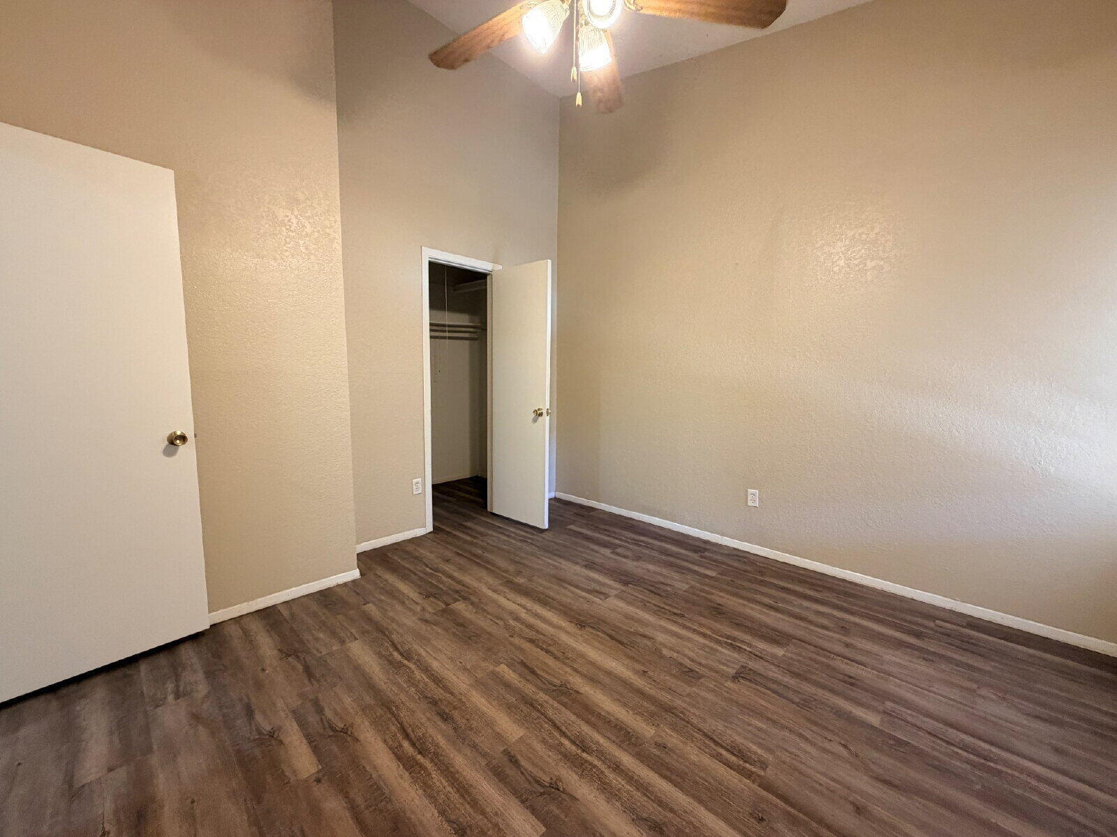 129 North Troy Avenue, Unit B Lubbock, TX 79416 - Photo 8 of 9 a view of an empty room with wooden floor
