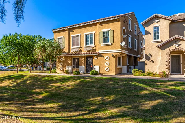 a front view of a house with a yard