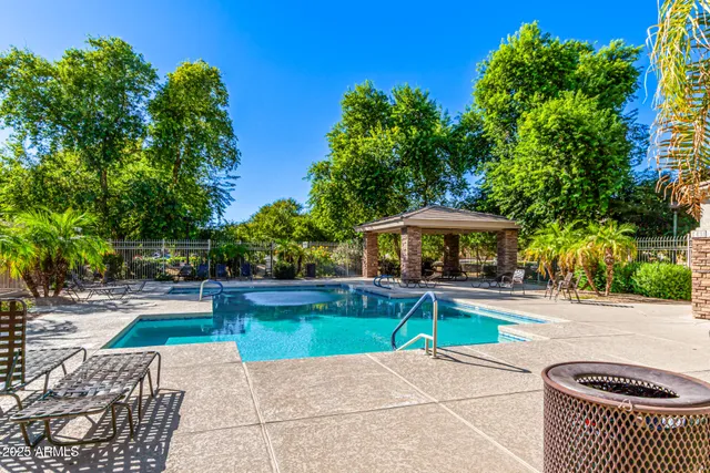 a view of a swimming pool with a patio