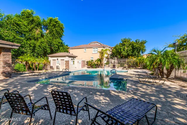 a view of a backyard with sitting area