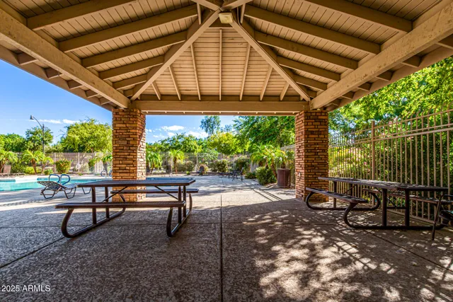 a house view with a sitting space and garden