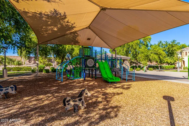 a view of a park with iron fence