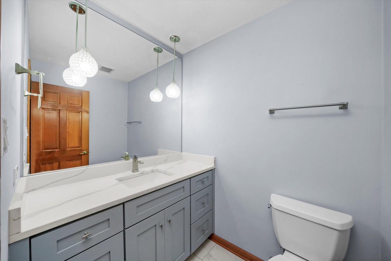 Undisclosed Address Naperville, IL 60563 - Photo 13 of 30 a bathroom with a sink a toilet and a mirror