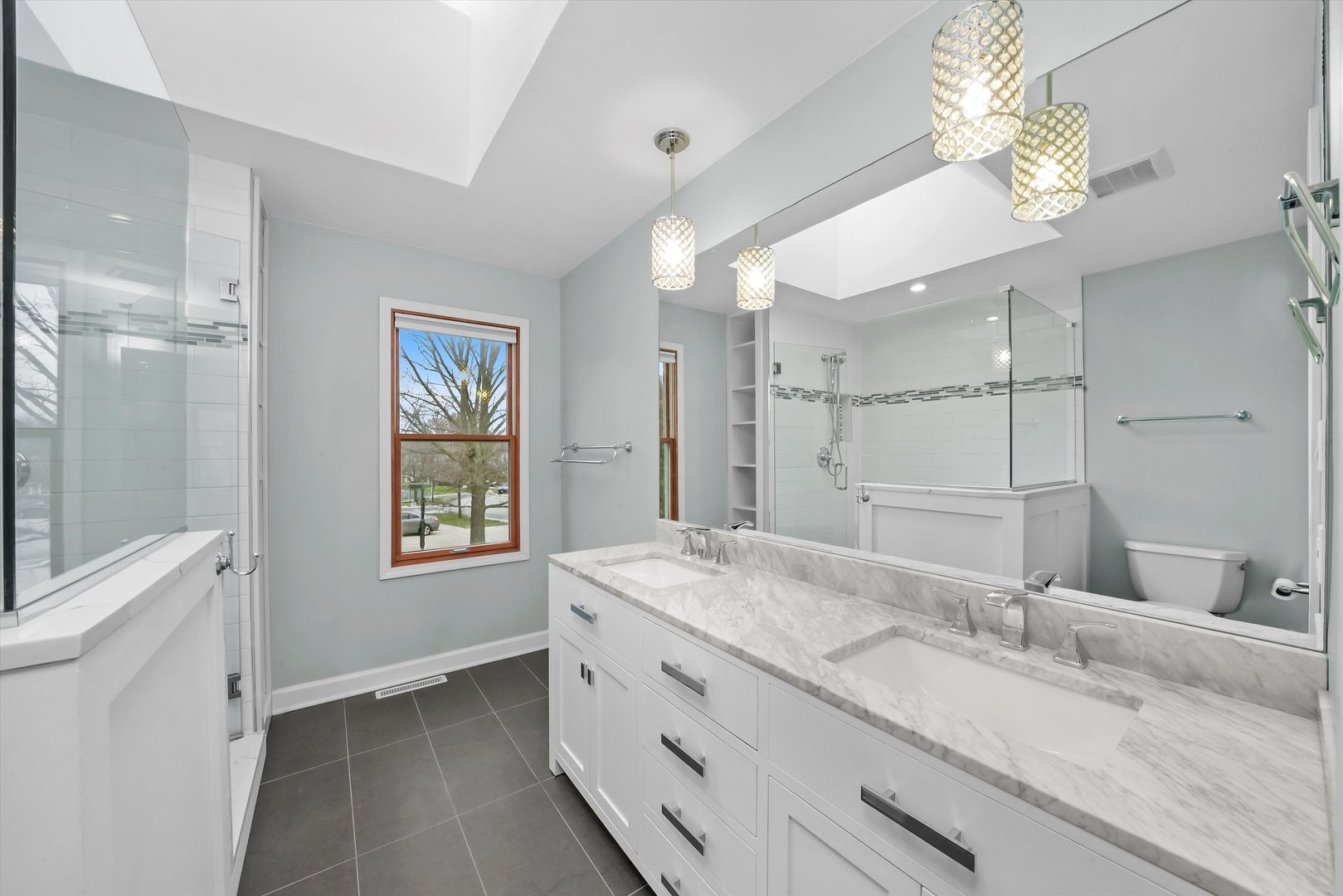 Undisclosed Address Naperville, IL 60563 - Photo 16 of 30 a bathroom with a granite countertop double vanity sink a mirror and a shower