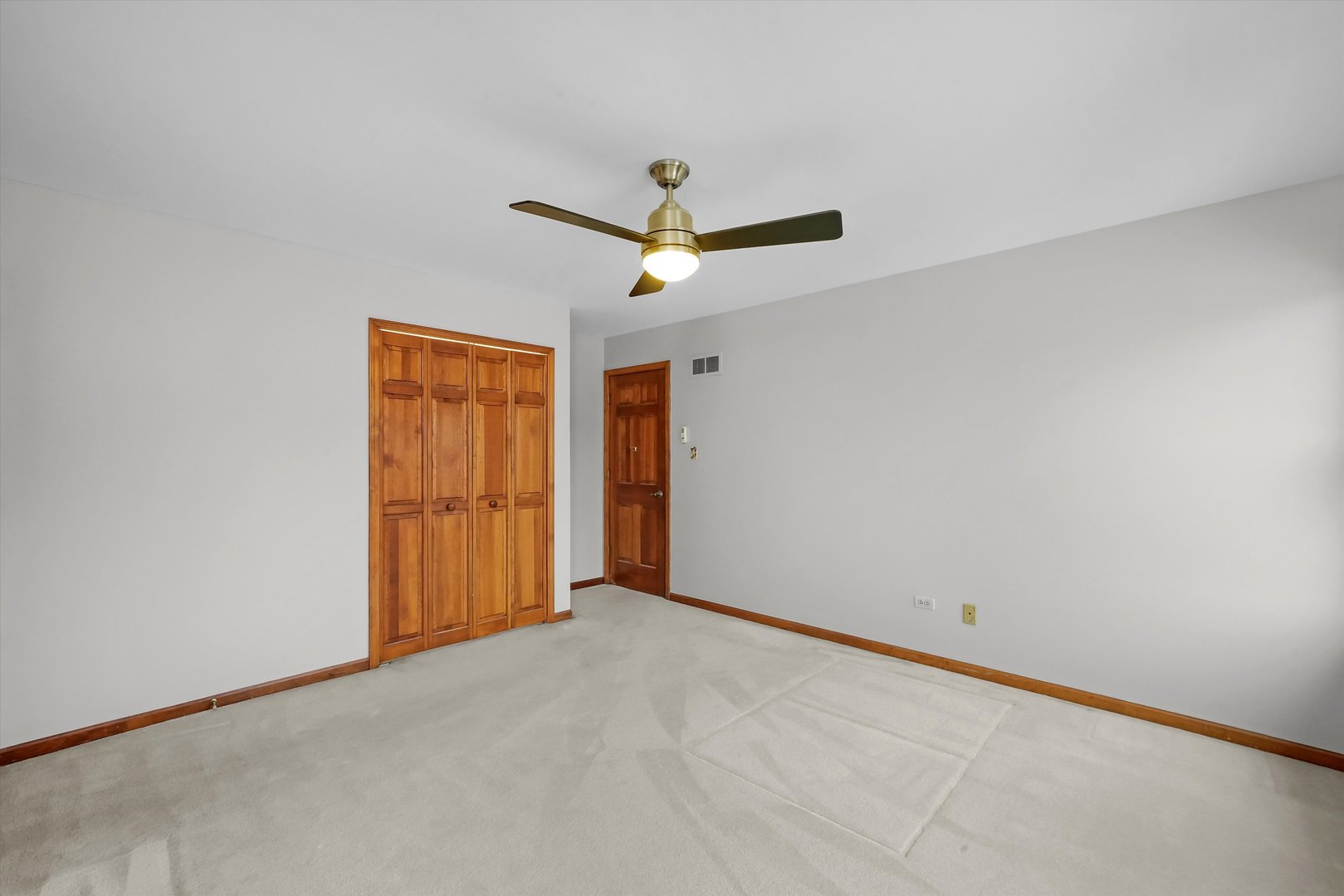 Undisclosed Address Naperville, IL 60563 - Photo 21 of 30 an empty room with ceiling fan and window