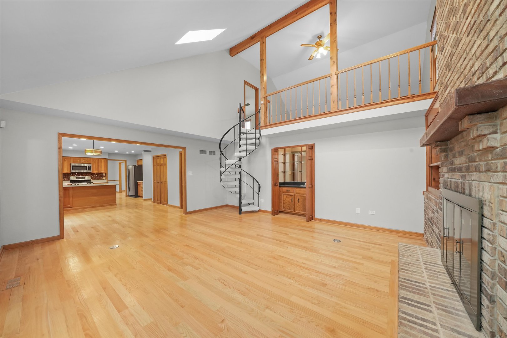 Undisclosed Address Naperville, IL 60563 - Photo 4 of 30 a view of empty room with wooden floor and fan