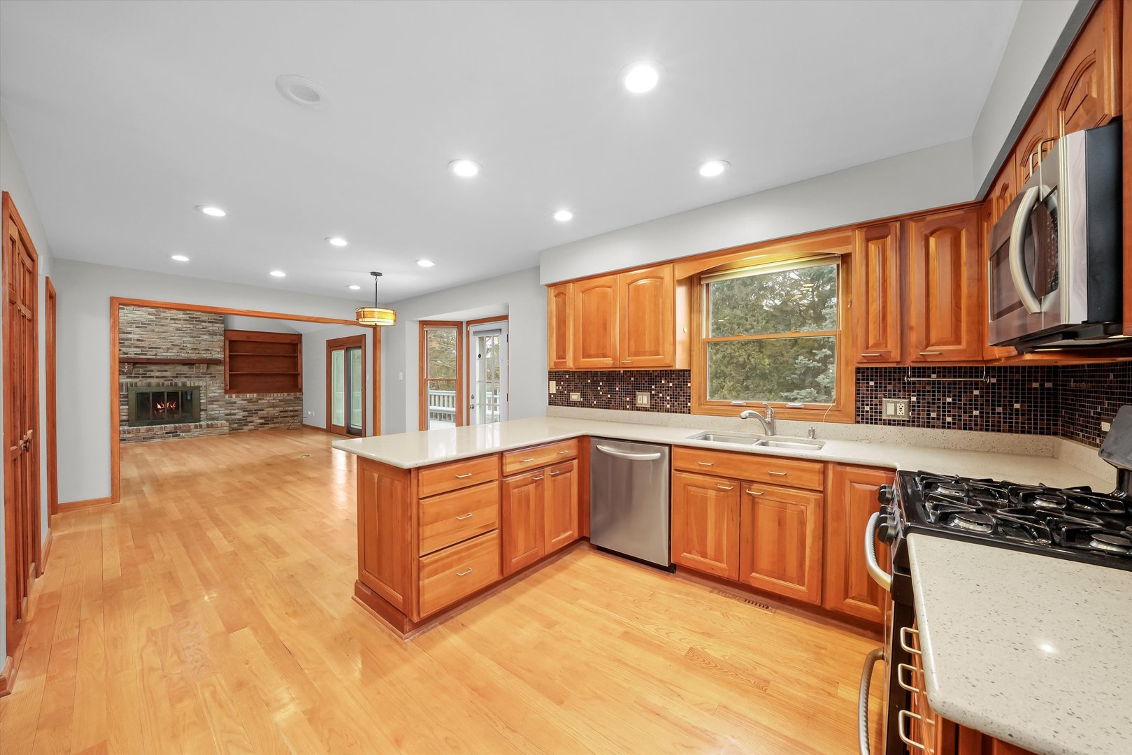 Undisclosed Address Naperville, IL 60563 - Photo 7 of 30 a kitchen with stainless steel appliances granite countertop a stove and a sink