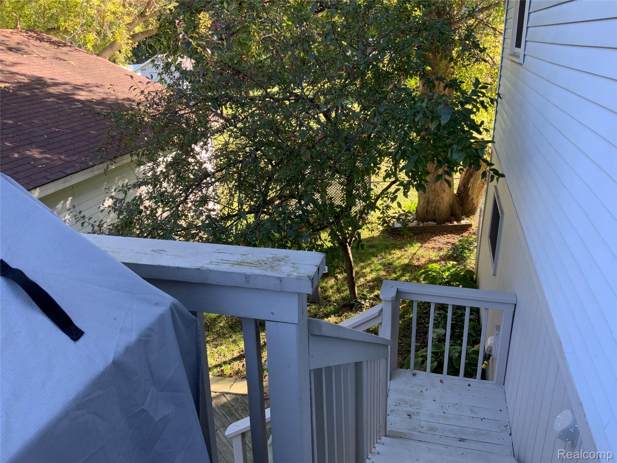 3828 Morgan Road Lake Orion, MI 48359 - Photo 27 of 39 Outdoor decking with painted railing and steps