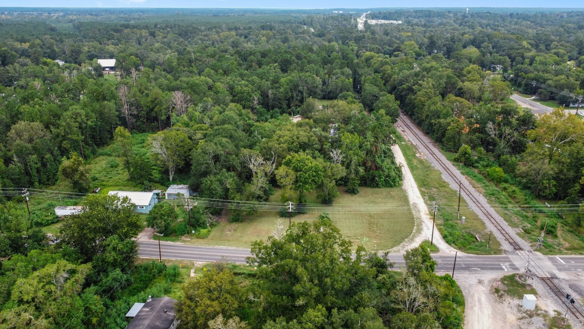 328 West Fm Goodrich, TX 77335 - Photo 3 of 8 an aerial view of residential house with outdoor space and trees