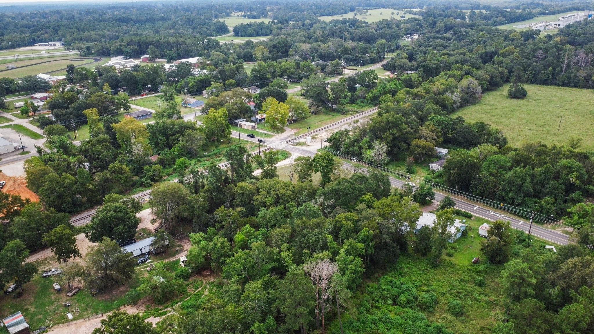 328 West Fm Goodrich, TX 77335 - Photo 6 of 8 an aerial view of residential houses with outdoor space and trees