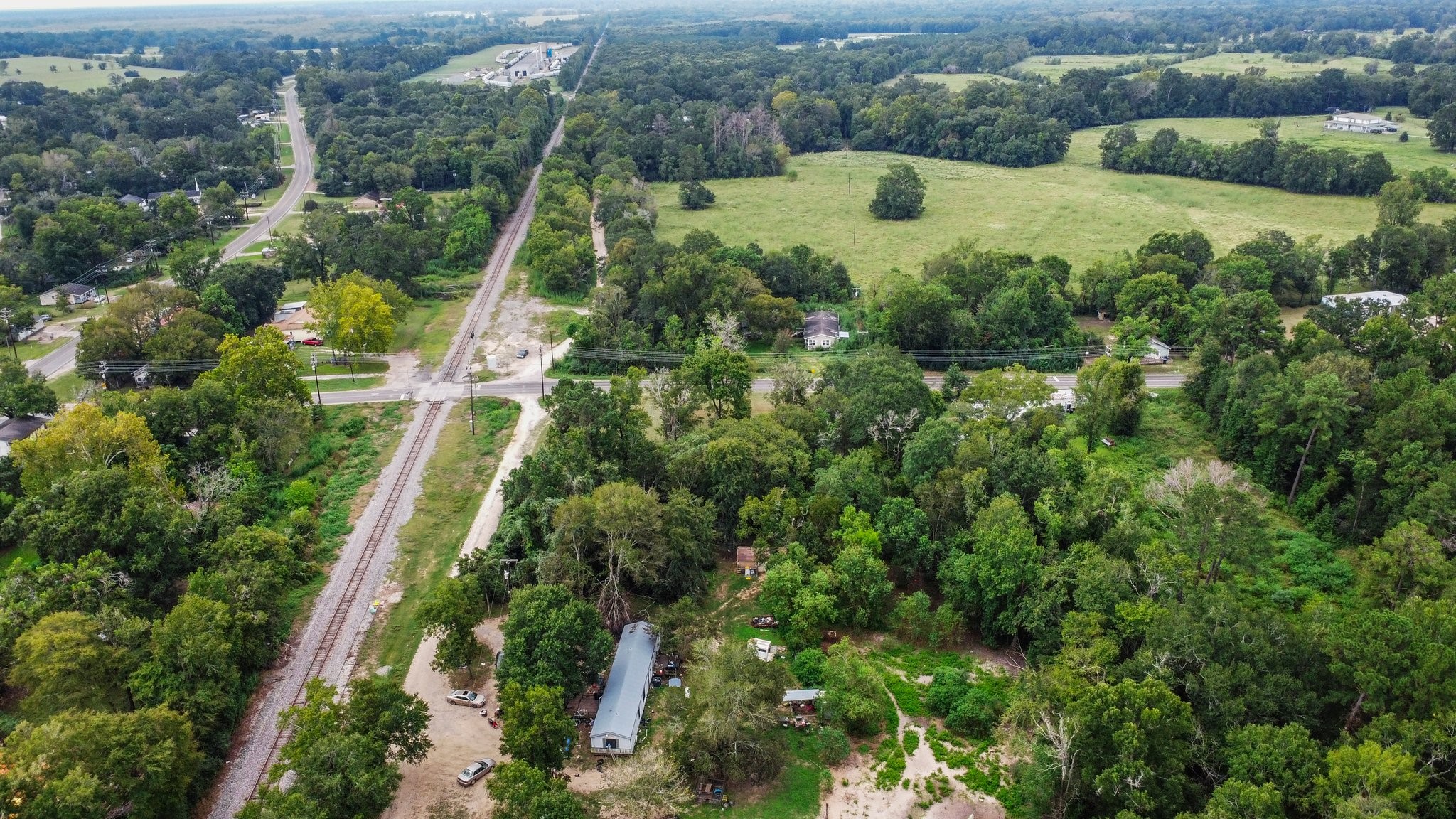 328 West Fm Goodrich, TX 77335 - Photo 7 of 8 an aerial view of a house with a yard