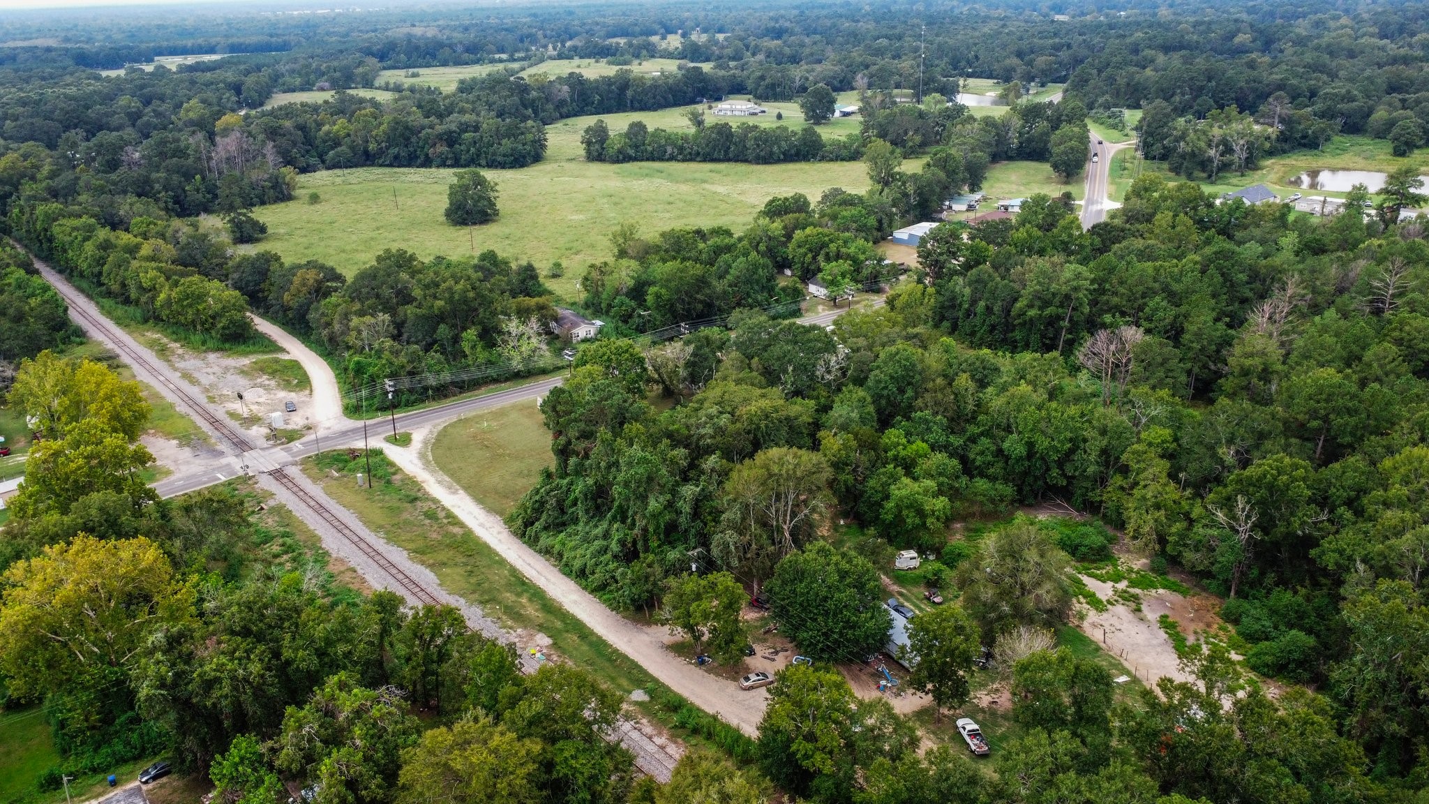 328 West Fm Goodrich, TX 77335 - Photo 8 of 8 an aerial view of residential house with outdoor space and trees all around