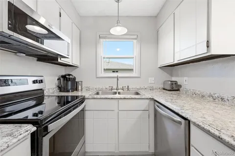 a bed room with a bed and a television