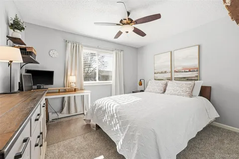 a view of balcony with wooden floor and outdoor seating